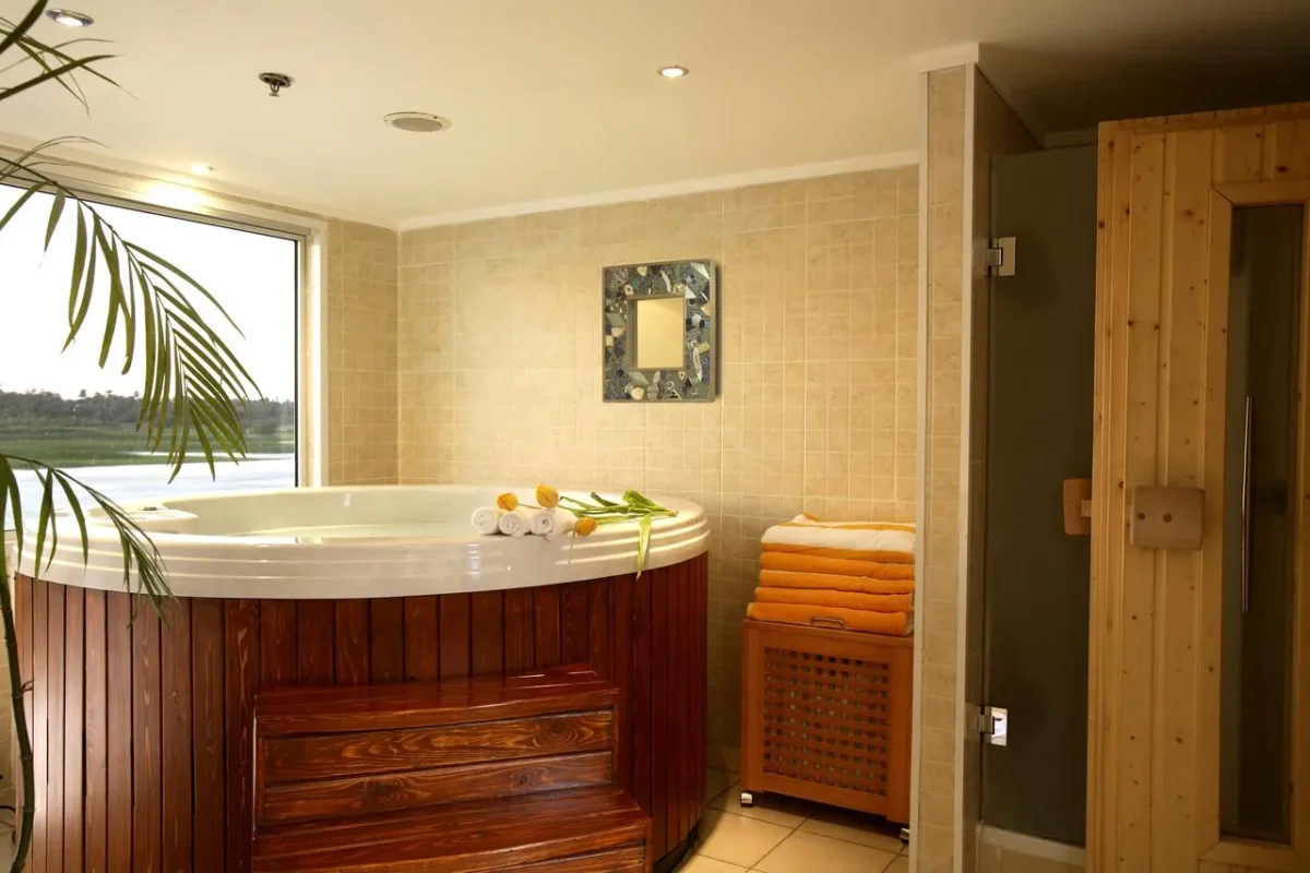 A round jacuzzi beside the timber sauna door in the spa of the Sonesta Star Goddess Nile cruise