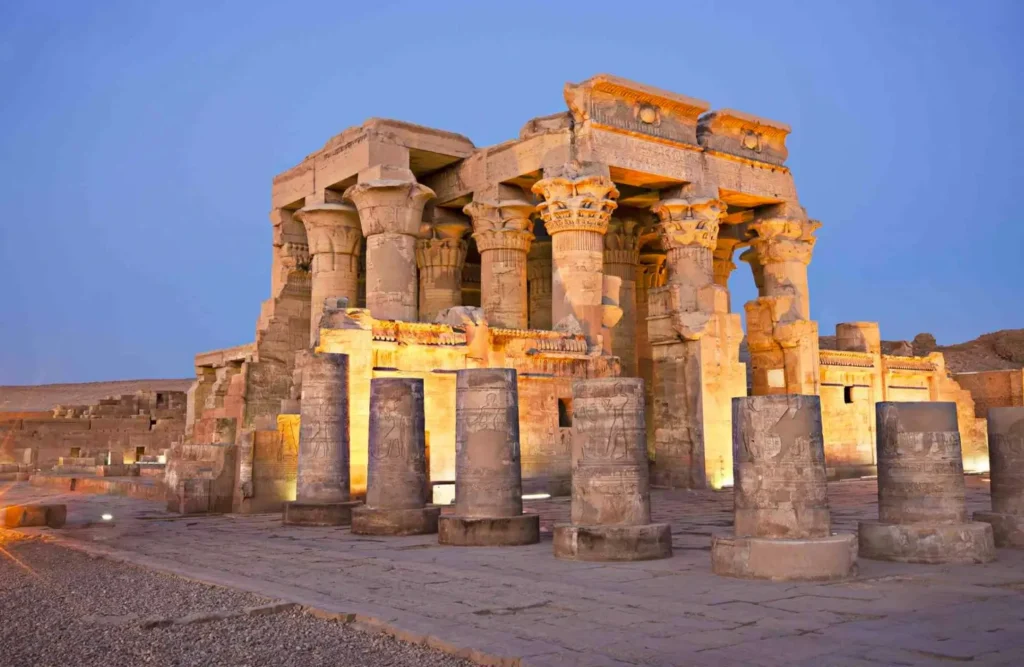 The columns and screen walls of the Temple of Kom Ombo lit against the dusk sky