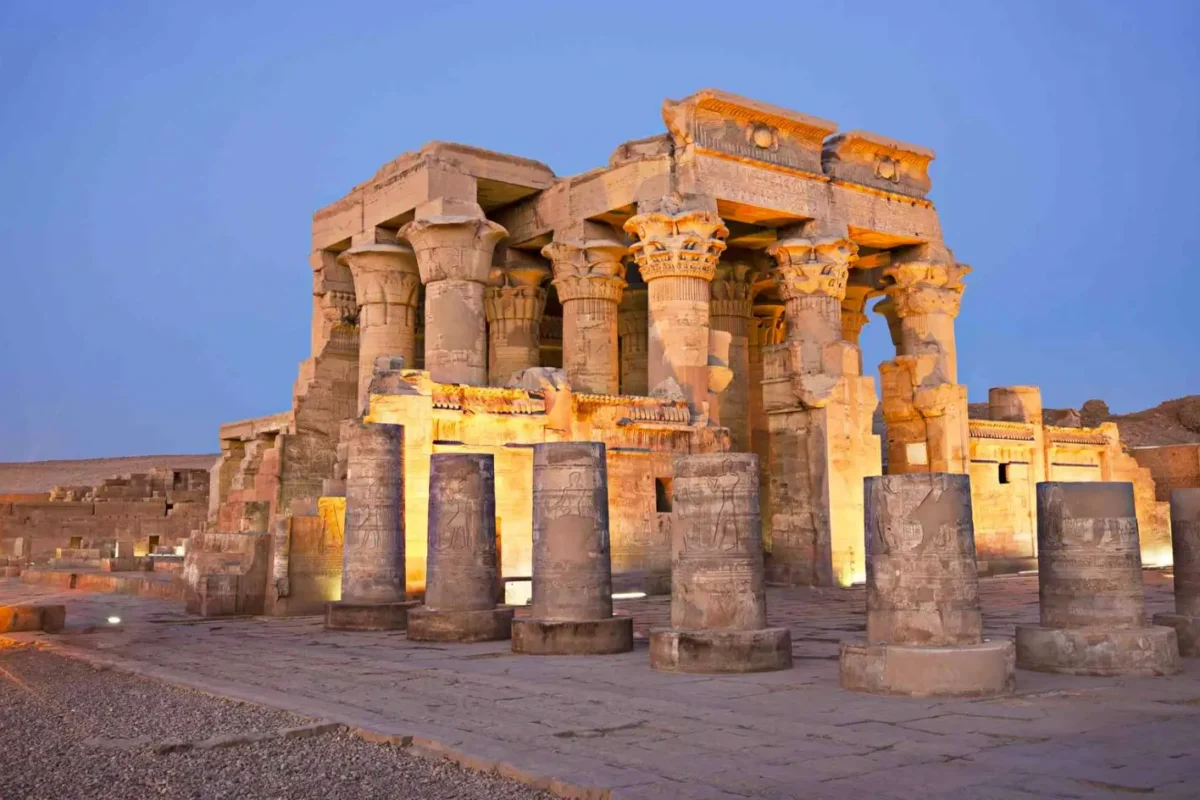 The columns and screen walls of the Temple of Kom Ombo lit against the dusk sky