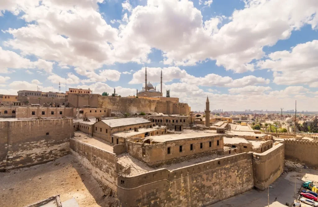 The rooftops and ramparts of the Saladin Citadel with the Alabaster Mosque and the Cairo skyline stretching beyond