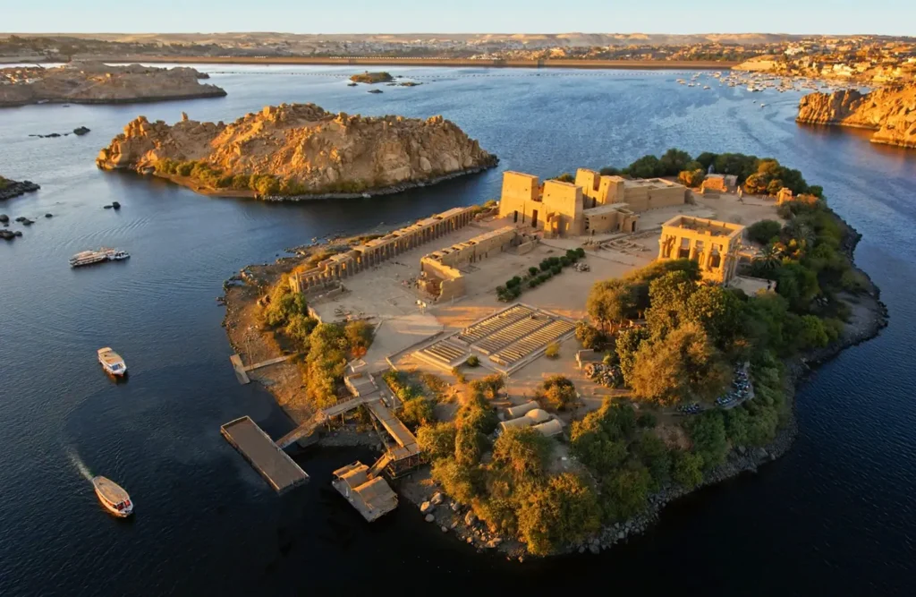 Agilkia Island from the air, the Temple of Philae at its centre with boats moored at the landing