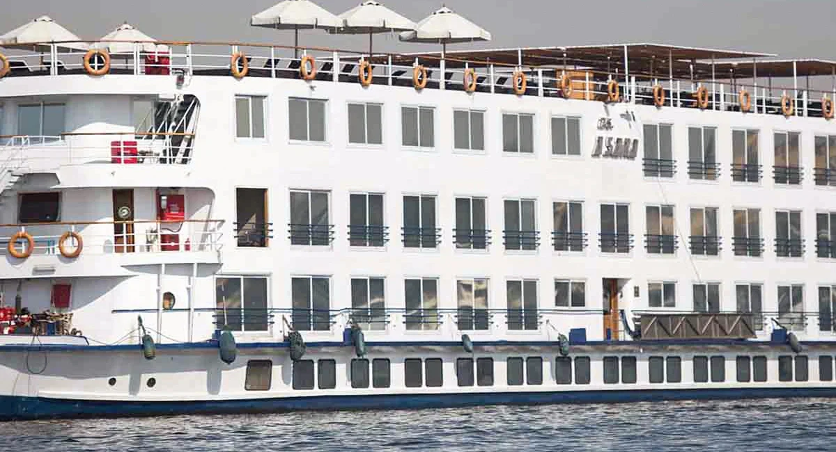 The A Sara Nile cruise ship on the water, white parasols lining the sun deck above four rows of cabin windows