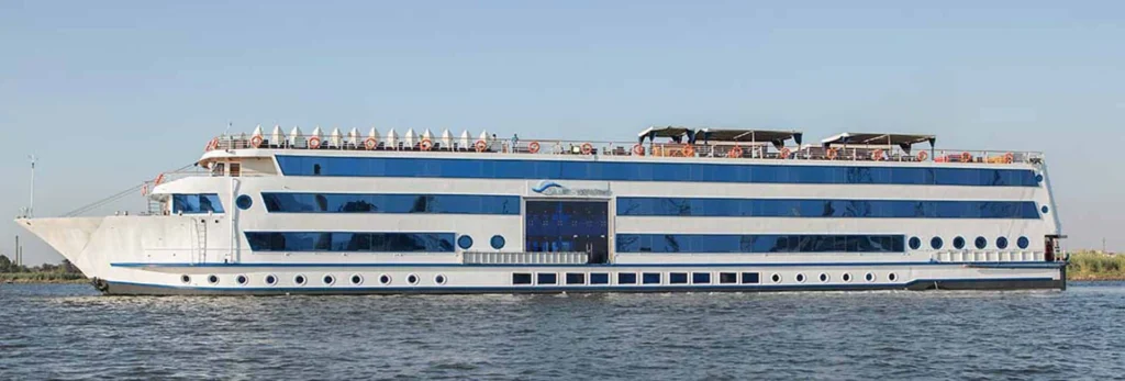 The Blue Shadow Nile cruise ship on the water, a blue band running the length of its white hull