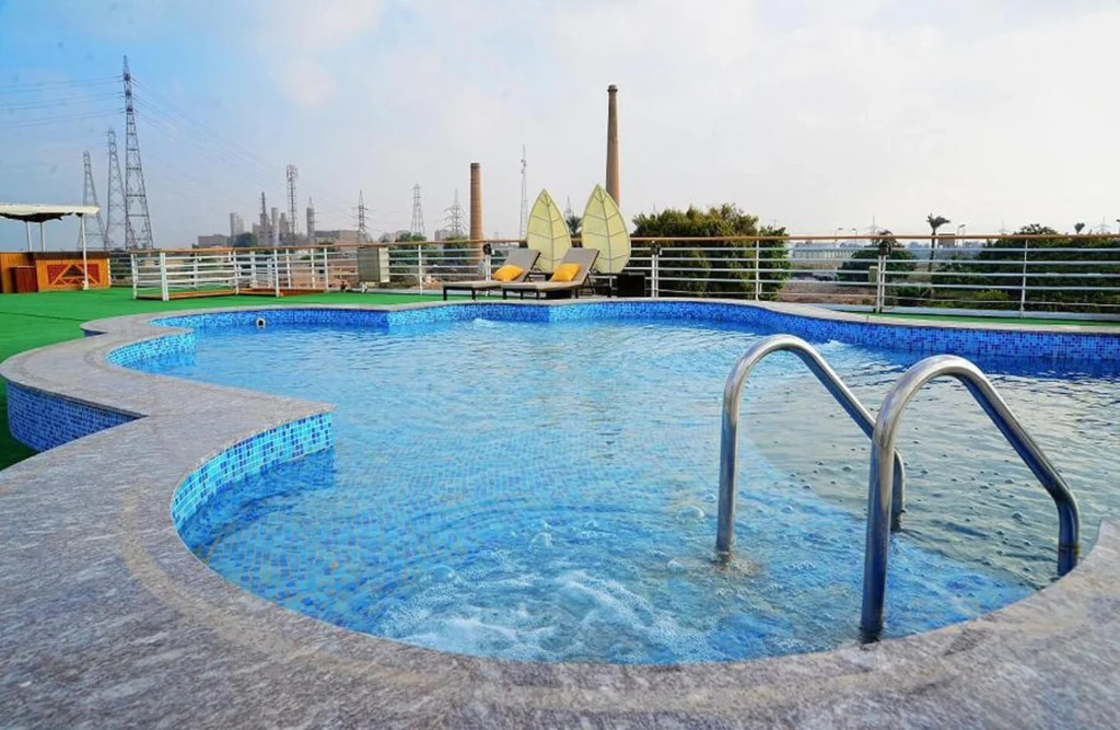 The swimming pool on the Blue Shadow Nile cruise sun deck, with a shallow ledge and handrail steps into the water