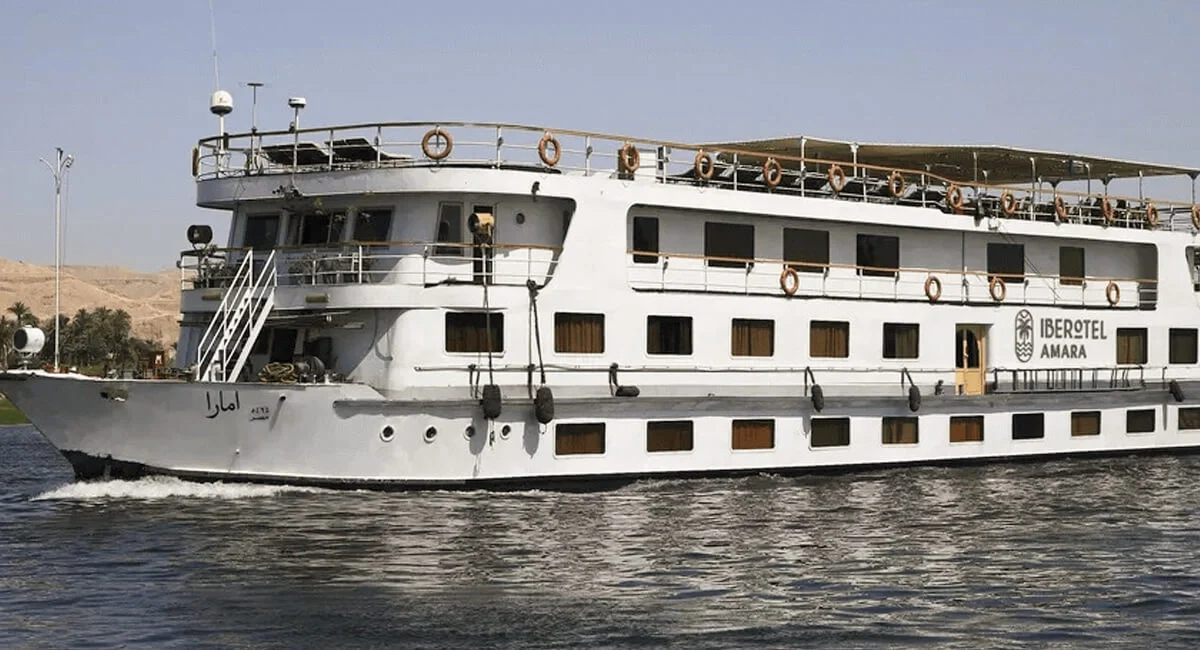 The Iberotel Amara Nile cruise ship under way, its white superstructure above three rows of cabin windows