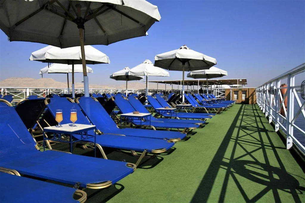 Blue loungers and parasols down the length of the Iberotel Crown Emperor Nile cruise sun deck