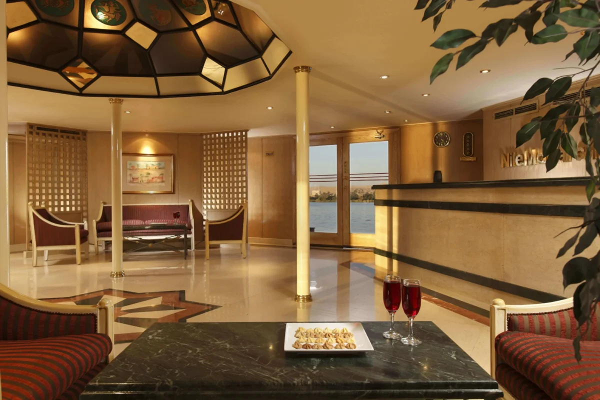 The reception of the Jaz Nile Monarch Nile cruise, a marble counter beneath a stained-glass ceiling dome