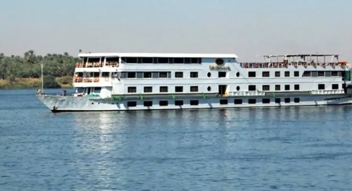 The Jaz Nile Monarch Nile cruise ship under way on the Nile, seen broadside from the water
