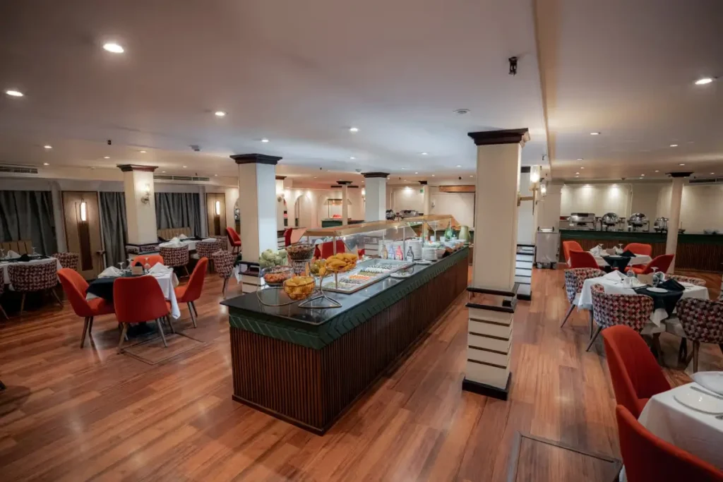 The buffet counter in the Lady Carol Nile cruise restaurant, fruit and dishes laid out along its length