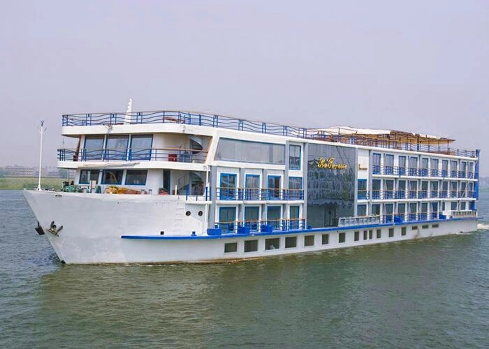 The MS Royal La Terrasse Nile cruise ship on the Nile, its white hull and glass-fronted upper deck seen from the bow